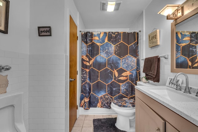 49 Flower Rd, Hopewell Junction, NY 12533 - full bath with tile patterned flooring, vanity, a shower with curtain, and tile walls