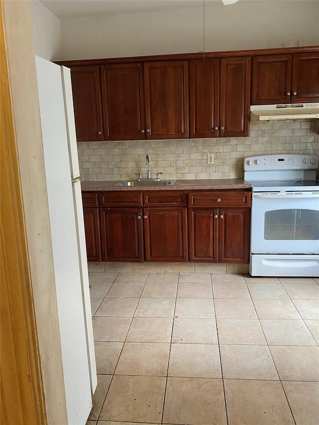 1624 Seddon St, Bronx, NY 10461 - kitchen featuring white appliances, decorative backsplash, under cabinet range hood, and light tile patterned floors