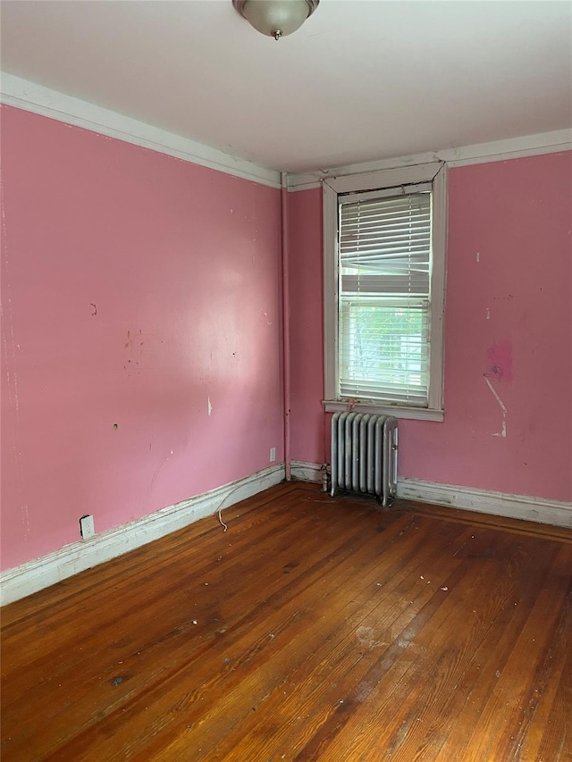 1624 Seddon St, Bronx, NY 10461 - unfurnished room featuring radiator and hardwood / wood-style floors