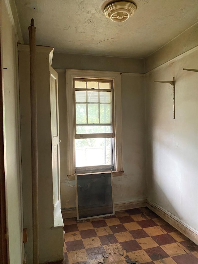 1624 Seddon St, Bronx, NY 10461 - spare room with tile patterned floors and baseboards