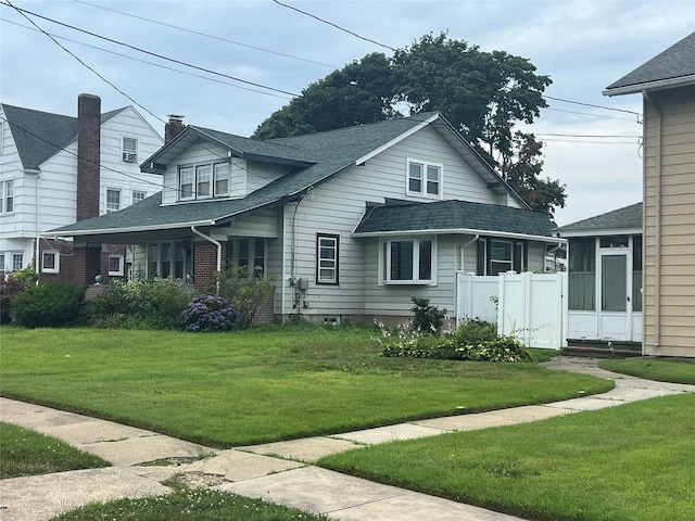 221 E Dean St, Freeport, NY 11520 - view of front of home with a shingled roof
