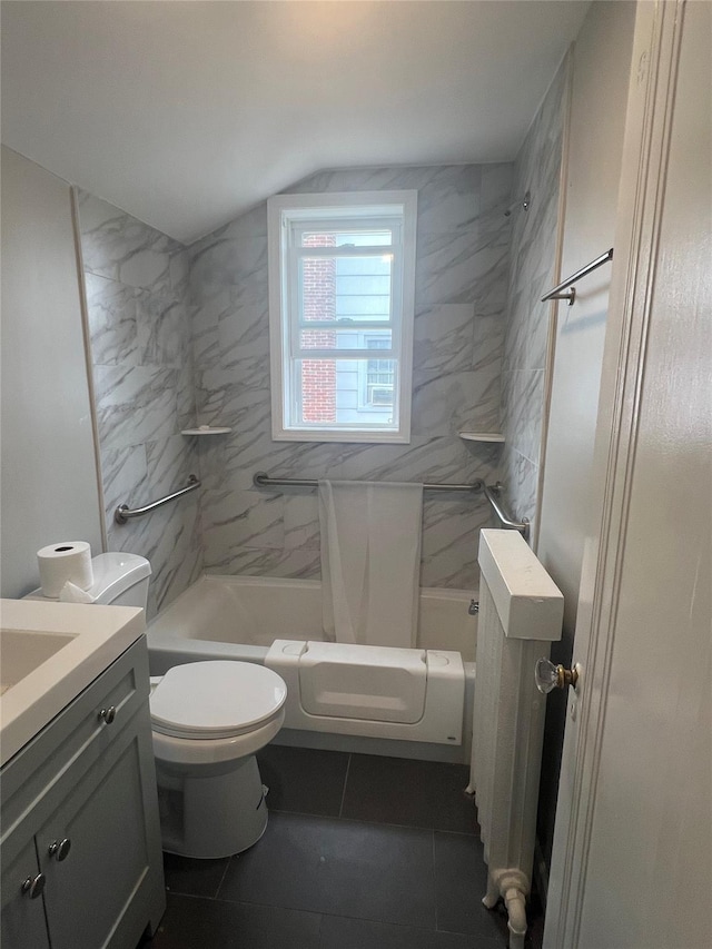 221 E Dean St, Freeport, NY 11520 - bathroom with vanity, washtub / shower combination, tile patterned flooring, and lofted ceiling