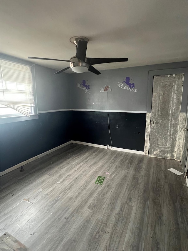 221 E Dean St, Freeport, NY 11520 - unfurnished bedroom with wood finished floors and a ceiling fan