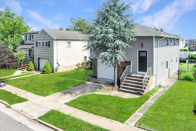 37 Martha St, Freeport, NY 11520 - view of front of property with a front lawn, asphalt driveway, and roof with shingles
