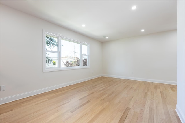 37 Martha St, Freeport, NY 11520 - empty room featuring light wood-type flooring and recessed lighting