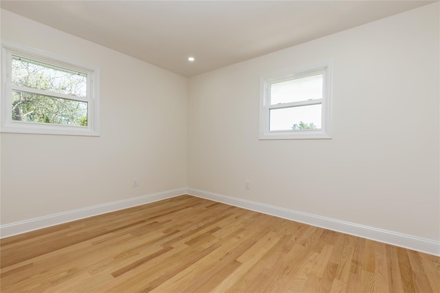 37 Martha St, Freeport, NY 11520 - unfurnished room featuring healthy amount of natural light, light wood-type flooring, and recessed lighting