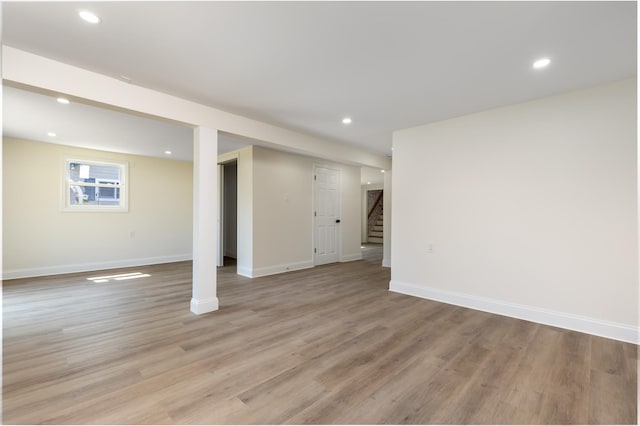 37 Martha St, Freeport, NY 11520 - below grade area featuring stairway, light wood-type flooring, and recessed lighting
