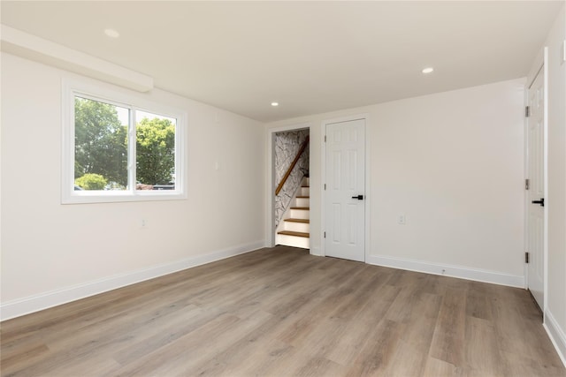 37 Martha St, Freeport, NY 11520 - spare room with light wood-style flooring, stairs, and recessed lighting
