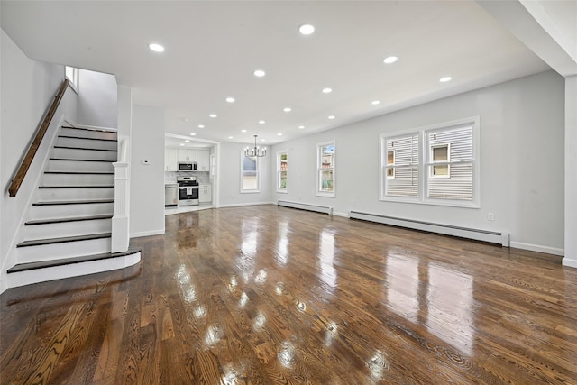234-16 134th Rd, Laurelton, NY 11422 - unfurnished living room with a baseboard radiator, a chandelier, wood finished floors, baseboard heating, and recessed lighting