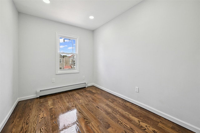 234-16 134th Rd, Laurelton, NY 11422 - unfurnished room with a baseboard heating unit, dark wood-type flooring, and recessed lighting