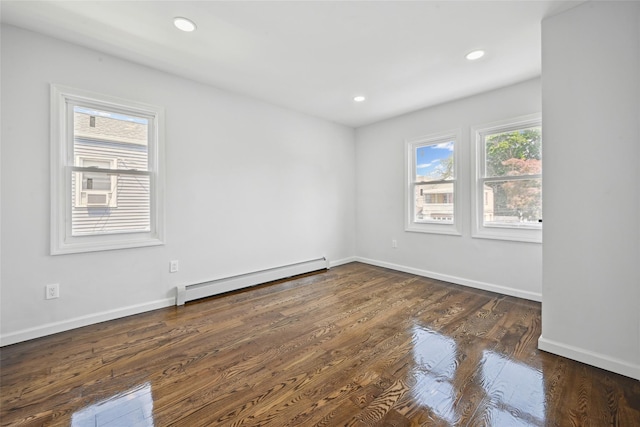 234-16 134th Rd, Laurelton, NY 11422 - spare room with a baseboard heating unit, wood finished floors, and recessed lighting