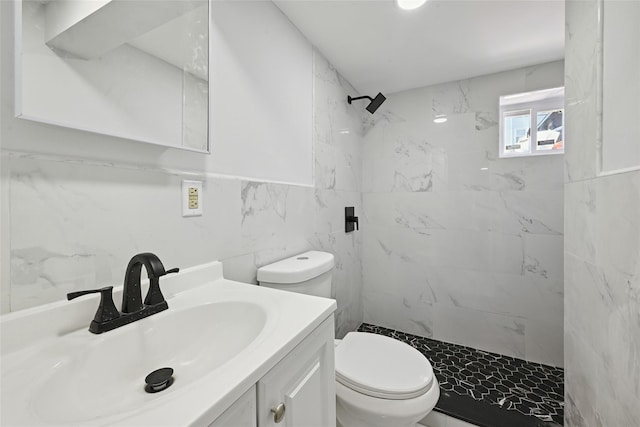 234-16 134th Rd, Laurelton, NY 11422 - bathroom featuring tiled shower, tile walls, and vanity