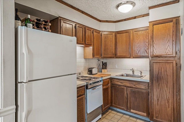 7-24 166th St Unit 8C, Beechhurst, NY 11357 - kitchen featuring white appliances, a textured ceiling, backsplash, brown cabinetry, and light countertops
