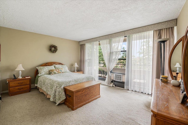7-24 166th St Unit 8C, Beechhurst, NY 11357 - carpeted bedroom with access to exterior, a textured ceiling, and cooling unit