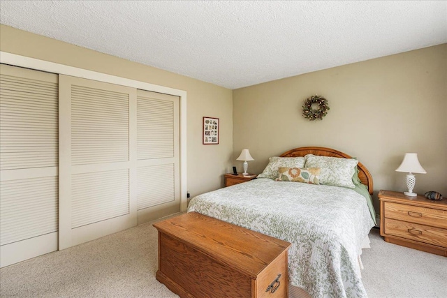 7-24 166th St Unit 8C, Beechhurst, NY 11357 - bedroom with carpet flooring, a closet, and a textured ceiling