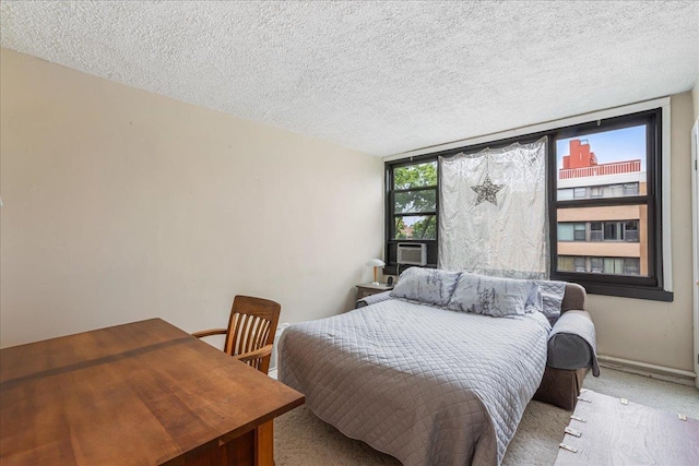 7-24 166th St Unit 8C, Beechhurst, NY 11357 - carpeted bedroom featuring a textured ceiling and cooling unit