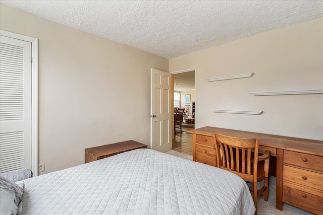 7-24 166th St Unit 8C, Beechhurst, NY 11357 - bedroom with a desk and a textured ceiling