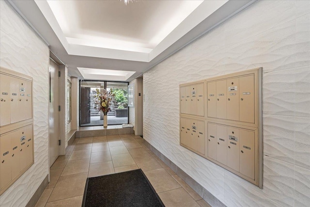 7-24 166th St Unit 8C, Beechhurst, NY 11357 - hallway featuring mail area, light tile patterned floors, and a tray ceiling