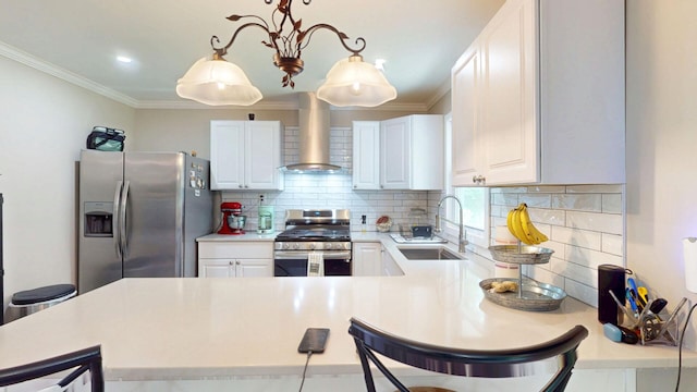 16-18 Claremont Ct, Middletown, NY 10940 - kitchen featuring appliances with stainless steel finishes, wall chimney exhaust hood, light countertops, tasteful backsplash, and white cabinetry