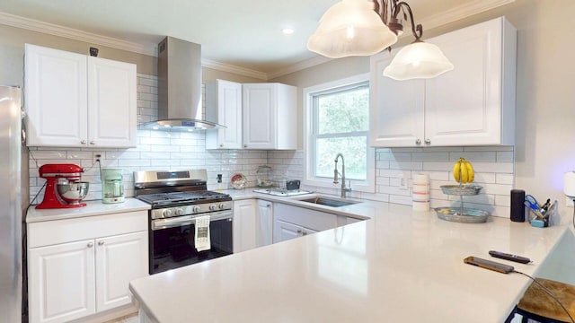 16-18 Claremont Ct, Middletown, NY 10940 - kitchen featuring wall chimney exhaust hood, stainless steel appliances, white cabinets, and ornamental molding