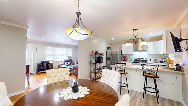 16-18 Claremont Ct, Middletown, NY 10940 - dining space with light wood finished floors, recessed lighting, and ornamental molding