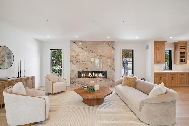 23 Sylvan Rd, Rye Brook, NY 10573 - living room with recessed lighting, a fireplace, healthy amount of natural light, and light wood finished floors
