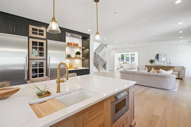23 Sylvan Rd, Rye Brook, NY 10573 - kitchen featuring stainless steel built in fridge, decorative light fixtures, light wood-style flooring, and recessed lighting
