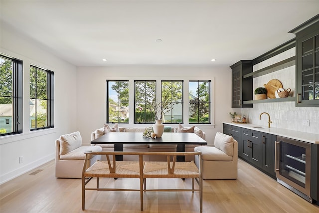 23 Sylvan Rd, Rye Brook, NY 10573 - dining area featuring wine cooler, plenty of natural light, light wood-type flooring, and recessed lighting