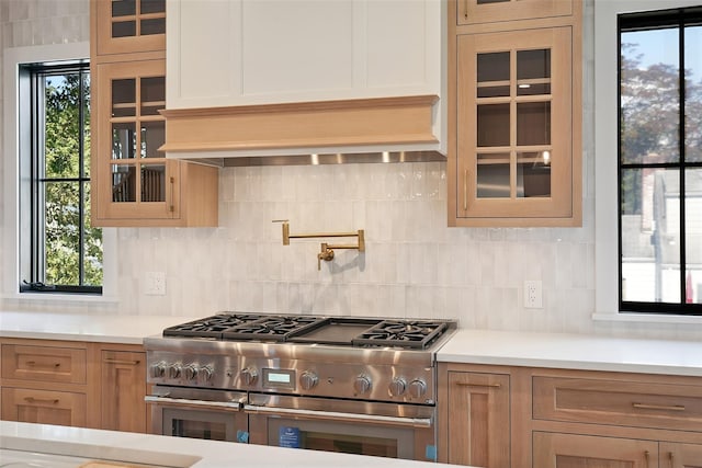 23 Sylvan Rd, Rye Brook, NY 10573 - kitchen featuring double oven range, light countertops, glass insert cabinets, and backsplash