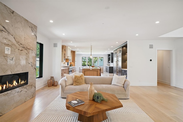 23 Sylvan Rd, Rye Brook, NY 10573 - living room with recessed lighting, light wood finished floors, and a fireplace