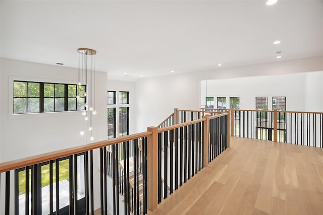 23 Sylvan Rd, Rye Brook, NY 10573 - hallway featuring wood finished floors, recessed lighting, and an upstairs landing