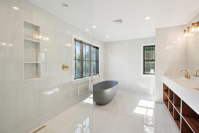 23 Sylvan Rd, Rye Brook, NY 10573 - bathroom with a soaking tub, double vanity, and tile patterned flooring