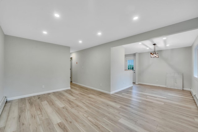 3 Auburn Ave, Bay Shore, NY 11706 - spare room featuring light wood-type flooring, recessed lighting, and a baseboard radiator