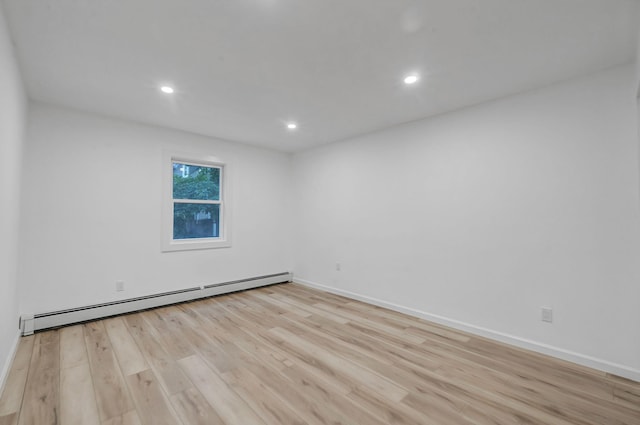 3 Auburn Ave, Bay Shore, NY 11706 - unfurnished room featuring a baseboard radiator, wood finished floors, and recessed lighting