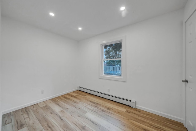 3 Auburn Ave, Bay Shore, NY 11706 - unfurnished room featuring a baseboard radiator, wood finished floors, and recessed lighting
