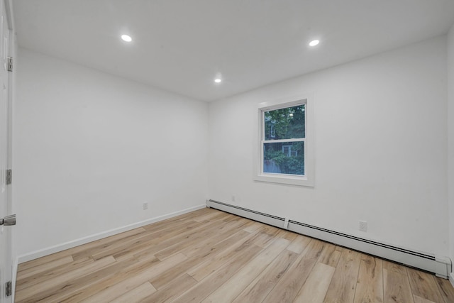 3 Auburn Ave, Bay Shore, NY 11706 - unfurnished room with a baseboard heating unit, wood finished floors, and recessed lighting