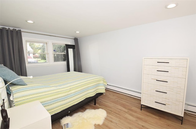 38 Loretta Dr, Syosset, NY 11791 - bedroom featuring a baseboard heating unit, wood finished floors, and recessed lighting