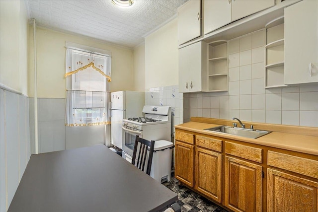 59-30 70th Ave, Ridgewood, NY 11385 - kitchen featuring open shelves, white appliances, brown cabinets, light countertops, and crown molding