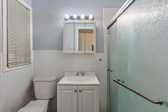 59-30 70th Ave, Ridgewood, NY 11385 - full bath with vanity, tile walls, a shower stall, and a wainscoted wall