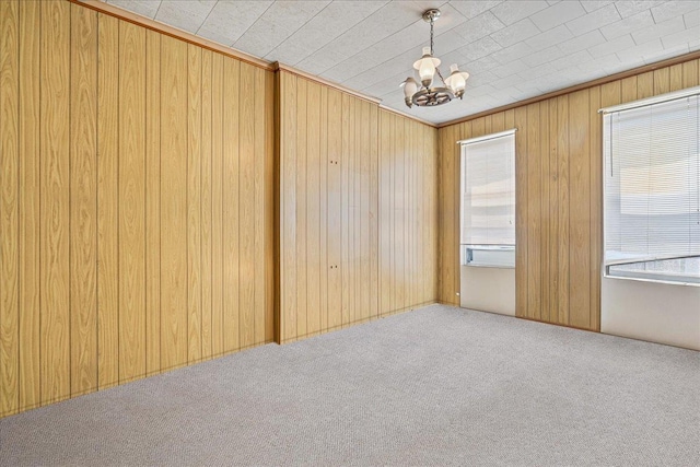 59-30 70th Ave, Ridgewood, NY 11385 - empty room with carpet flooring, a chandelier, and wooden walls