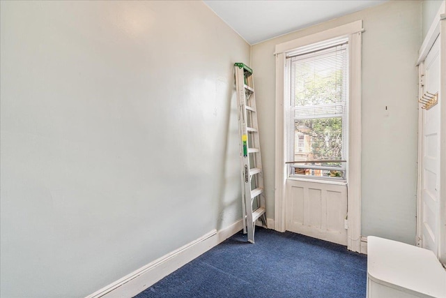 59-30 70th Ave, Ridgewood, NY 11385 - doorway to outside featuring dark carpet and baseboards