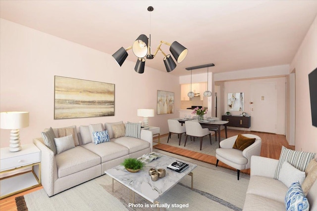 400 E 17th St Unit 600, Brooklyn, NY 11226 - living room featuring wood finished floors and a chandelier