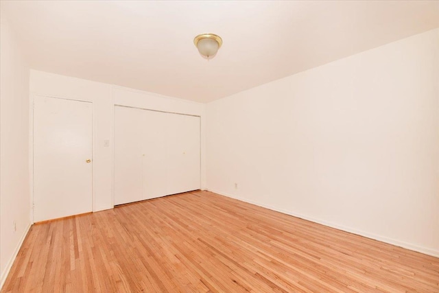 400 E 17th St Unit 600, Brooklyn, NY 11226 - unfurnished bedroom with light wood-type flooring and a closet