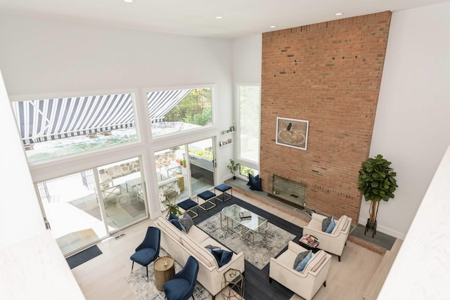 715 Hands Creek Rd, East Hampton, NY 11937 - living room with a towering ceiling, recessed lighting, and wood finished floors