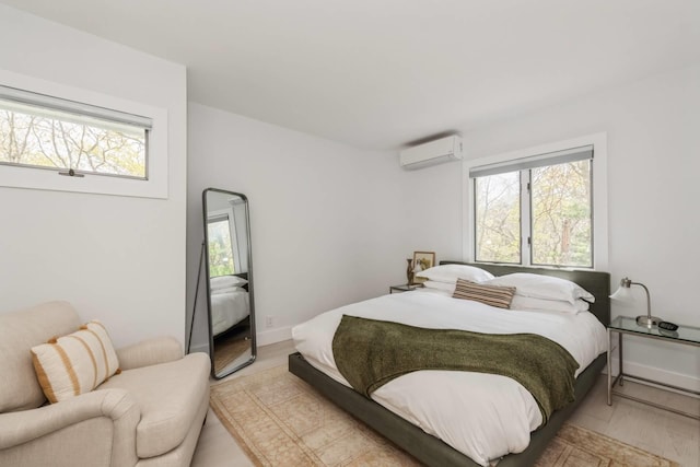 715 Hands Creek Rd, East Hampton, NY 11937 - bedroom featuring a wall mounted air conditioner and baseboards