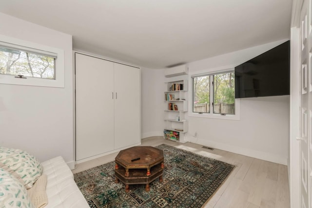 715 Hands Creek Rd, East Hampton, NY 11937 - living area with a wall mounted AC and light wood-style floors