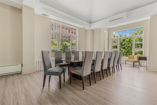 55 Oceana Dr E Unit 1B, Brooklyn, NY 11235 - dining room featuring a wall mounted AC, wood finished floors, and a baseboard radiator