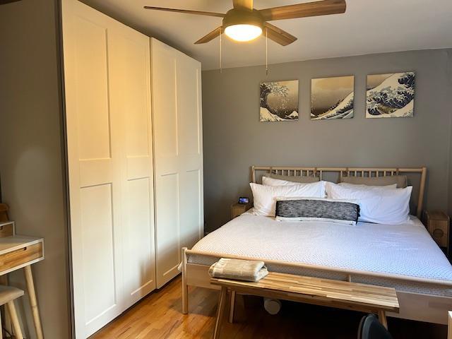199-39 19th Ave Upper, Upper, Whitestone, NY 11357 - bedroom with light wood-style floors and ceiling fan
