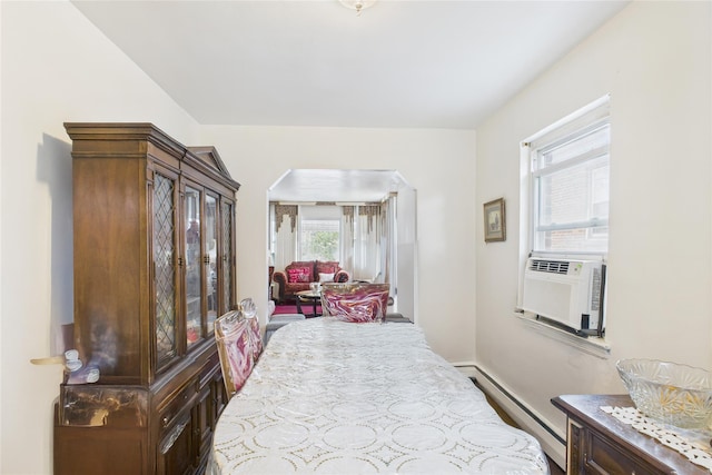 1472 Needham Ave, Bronx, NY 10469 - bedroom with baseboard heating and arched walkways