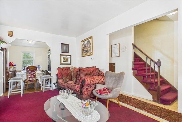 1472 Needham Ave, Bronx, NY 10469 - living area featuring stairs, carpet floors, and arched walkways